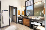Step into luxury with this stunning bathroom, featuring a sleek design and modern amenities.