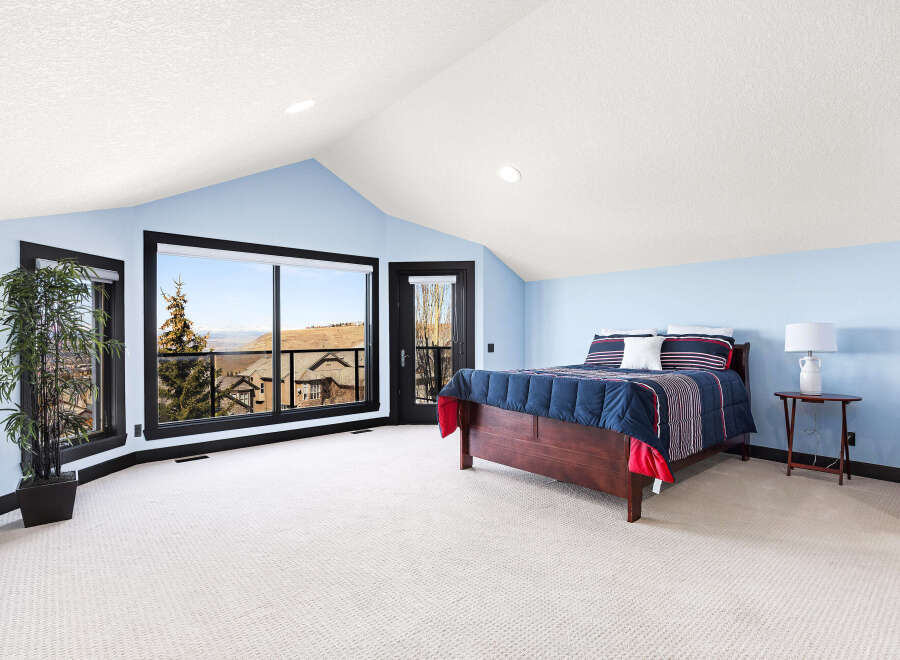 This stunning bedroom boasts a spacious layout and breathtaking views.