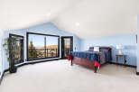 This stunning bedroom boasts a spacious layout and breathtaking views.