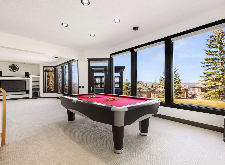 This stunning property boasts a spacious game room, perfect for entertaining and relaxation.