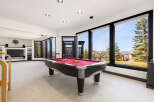 This stunning property boasts a spacious game room, perfect for entertaining and relaxation.