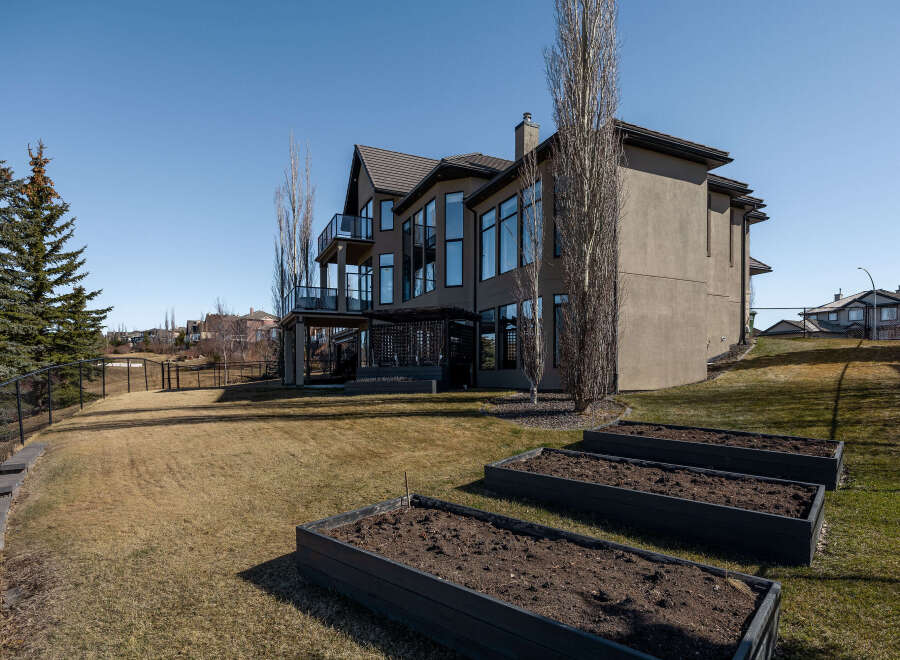 This stunning property boasts a modern exterior with a spacious backyard, perfect for outdoor living.