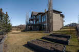 This stunning property boasts a modern exterior with a spacious backyard, perfect for outdoor living.
