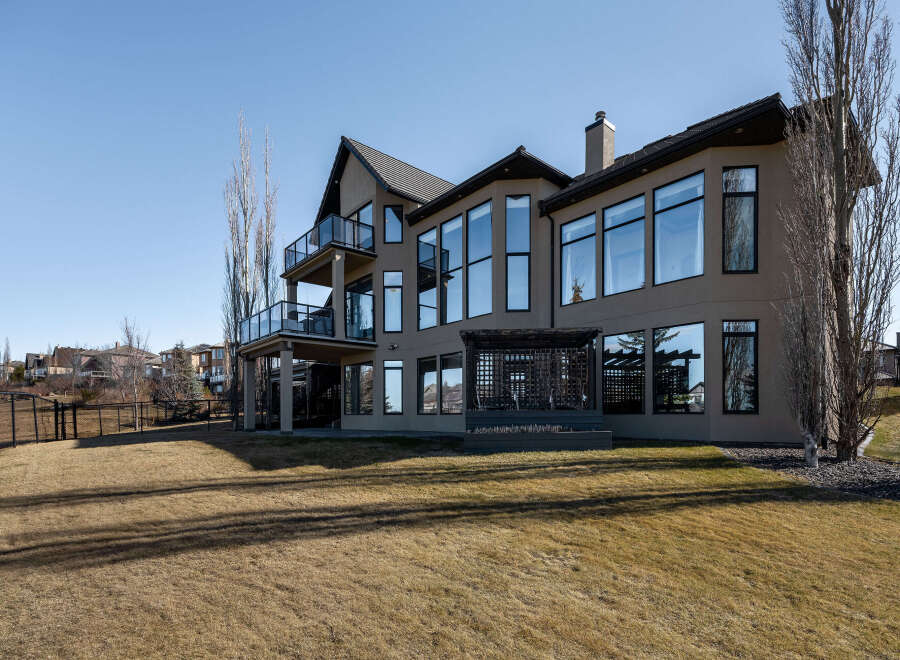 This stunning property boasts a modern design with expansive windows that flood the interior with natural light.