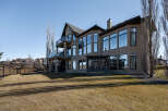 This stunning property boasts a modern design with expansive windows that flood the interior with natural light.