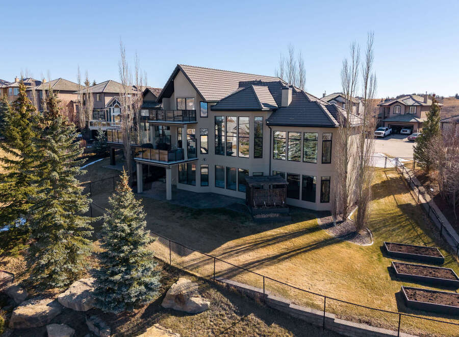 This stunning property boasts a modern design with expansive windows that flood the interior with natural light.