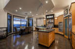 This stunning kitchen and dining area boasts a modern design with high-end finishes.