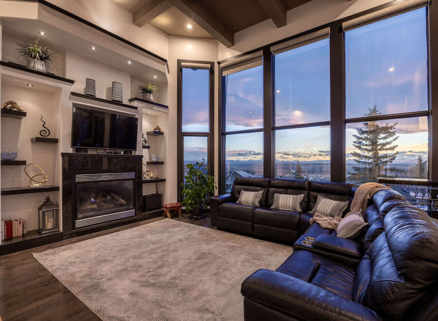 Experience luxury living in this stunning property featuring a cozy fireplace, perfect for chilly evenings.