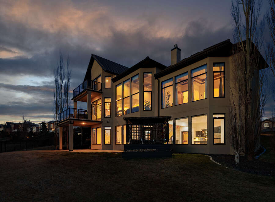 This stunning property showcases modern architecture with expansive windows, offering breathtaking views and abundant natural light.