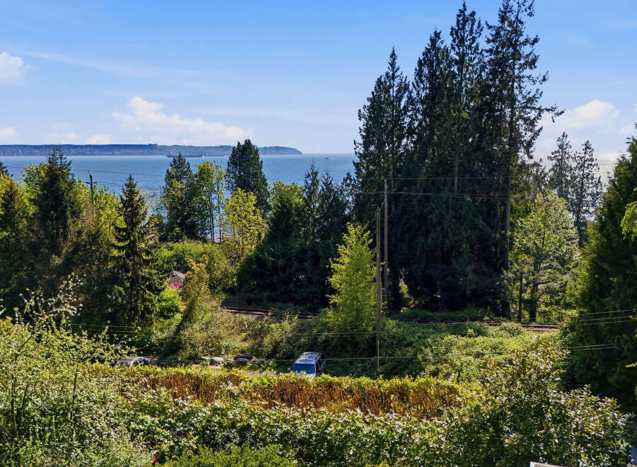 Enjoy breathtaking views from this stunning property! This home offers a serene escape with lush greenery and a tranquil waterfront backdrop.