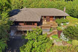 This stunning property boasts a beautiful wooden deck, perfect for enjoying the outdoors.