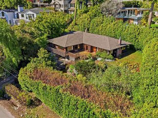 Nestled amidst lush greenery, this stunning property offers a serene retreat.