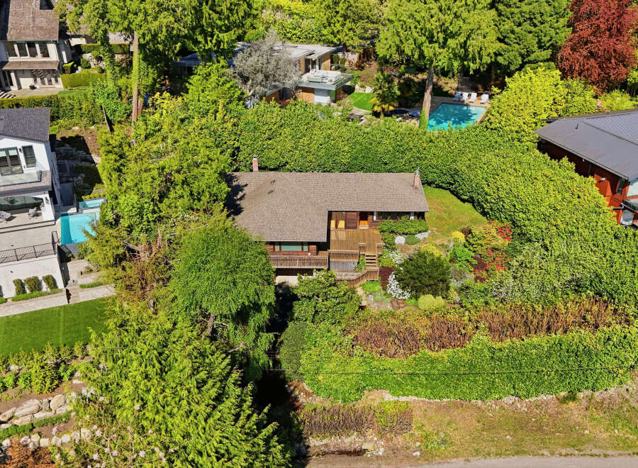 Nestled amidst lush greenery, this stunning property offers a serene escape.