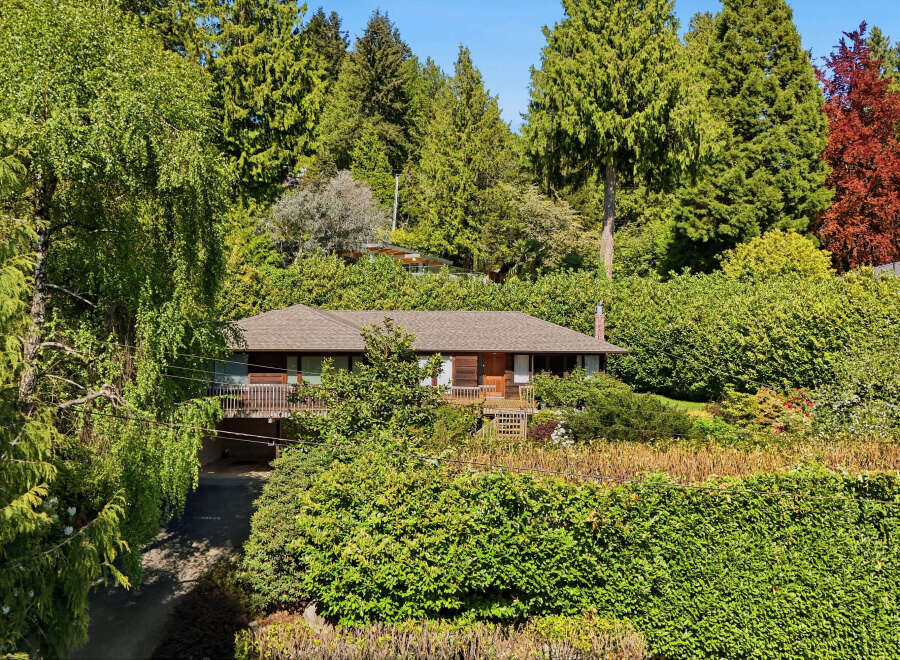 Nestled amidst lush greenery, this charming home offers a serene retreat.