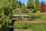 Nestled amidst lush greenery, this charming home offers a serene retreat.