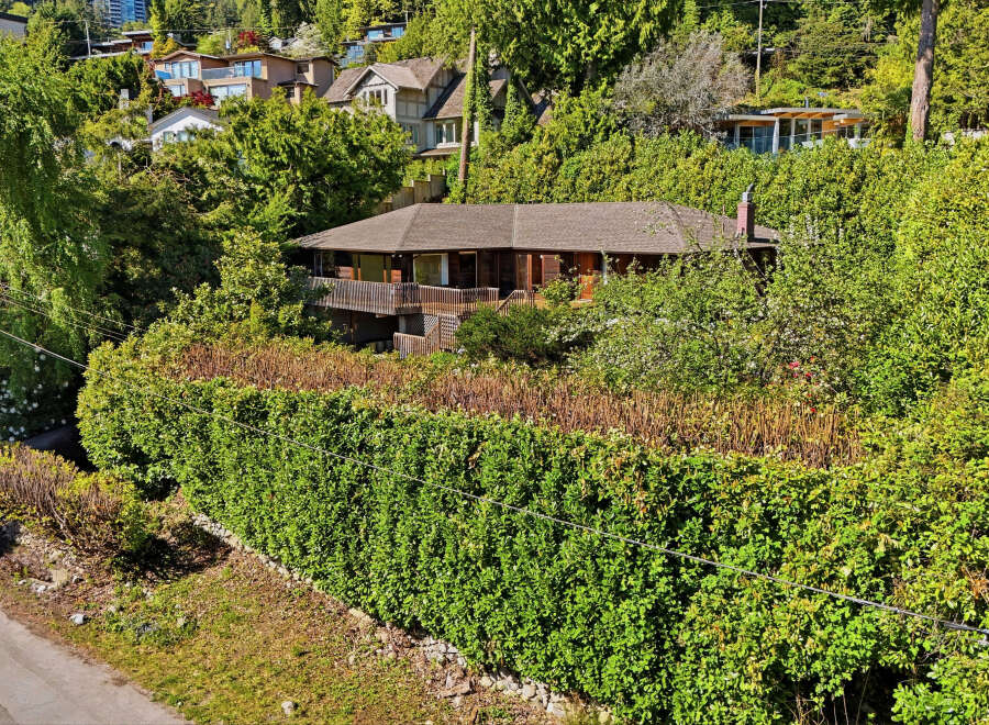 Nestled amidst lush greenery, this stunning property offers a serene retreat.