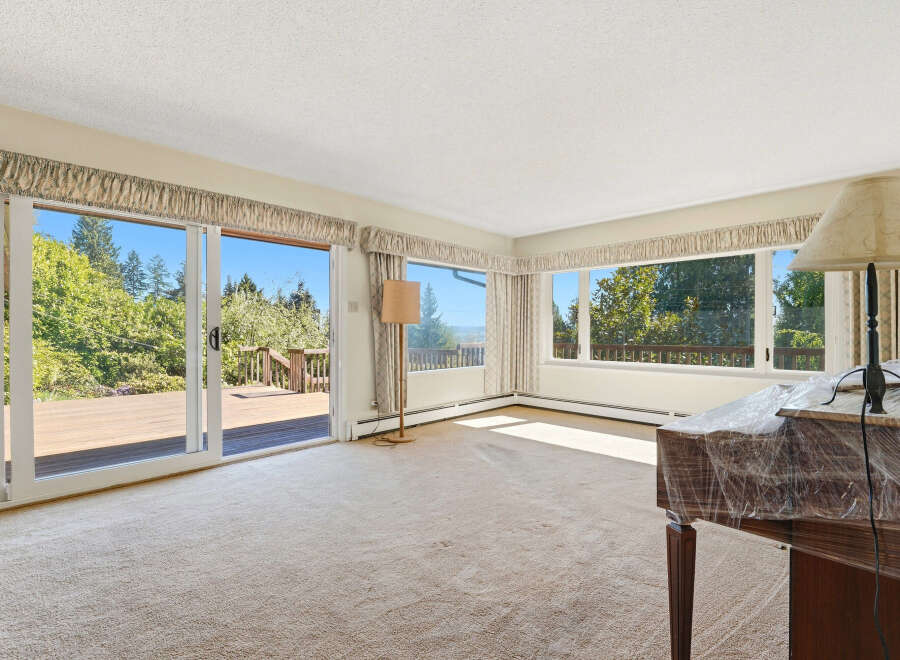 Step into this inviting living space, bathed in natural light and offering stunning views.