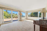 Step into this inviting living space, bathed in natural light and offering stunning views.