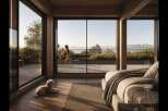 Experience serene living in this modern bedroom with expansive floor-to-ceiling windows offering breathtaking views of the landscape and water.