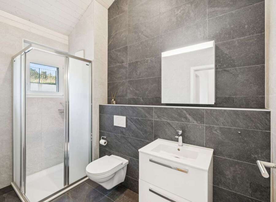 This modern bathroom boasts sleek design and functionality.