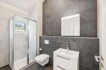 This modern bathroom boasts sleek design and functionality.