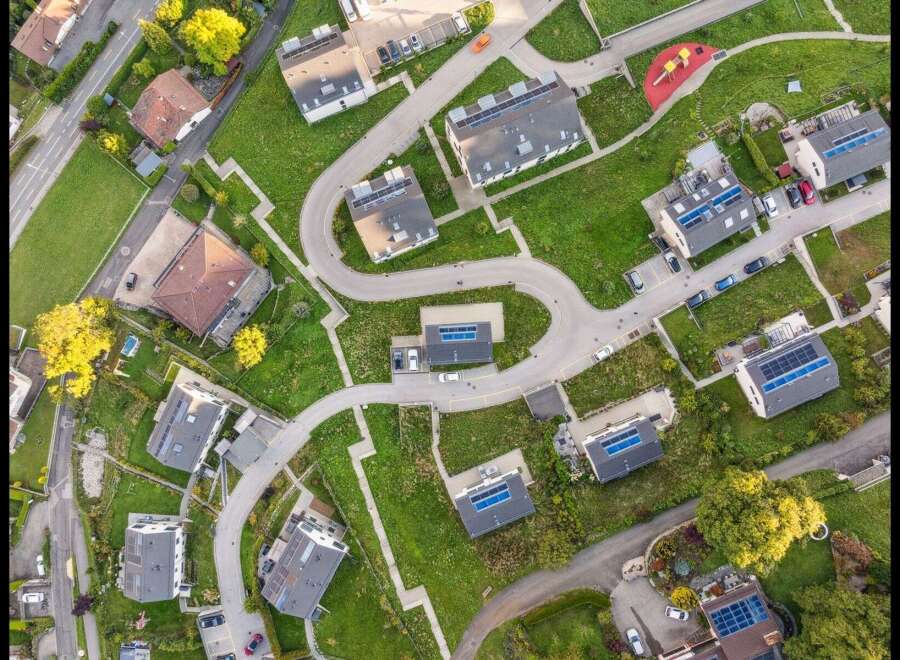 Discover modern living in this stunning aerial view of a residential neighborhood.