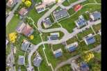 Discover modern living in this stunning aerial view of a residential neighborhood.