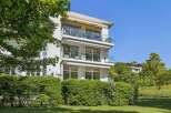 Discover modern living in this stunning three-story building with expansive balconies.