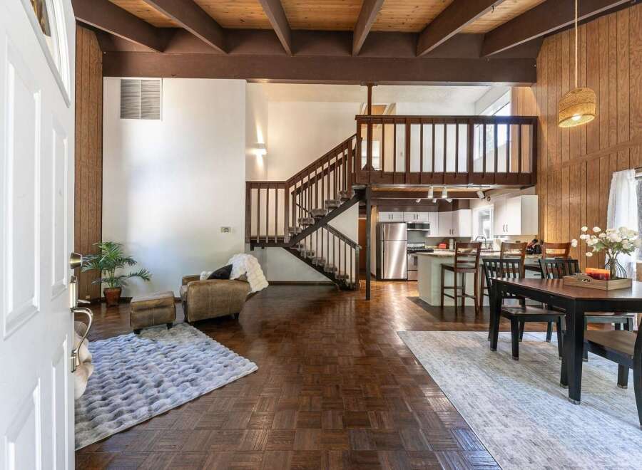 Step into this stunning home featuring a unique layout with a loft and a beautiful staircase.