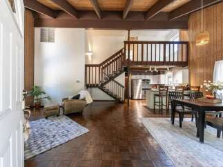 Step into this stunning home featuring a unique layout with a loft and a beautiful staircase.
