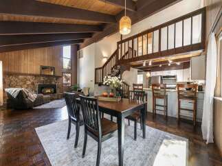 Step into this stunning home featuring a cozy fireplace, perfect for chilly evenings.
