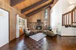 Step into this inviting living space, featuring a cozy fireplace and a plush rug, perfect for relaxing evenings.