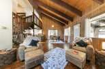 Step into this stunning property featuring a cozy living area with comfortable seating and a plush rug.