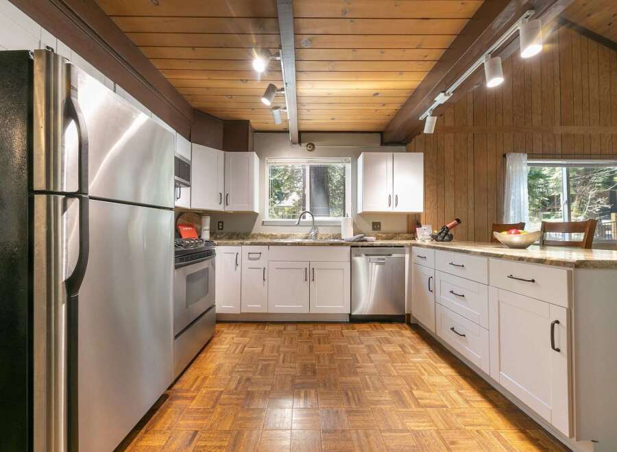 This stunning kitchen boasts a modern design with stainless steel appliances and ample counter space, perfect for culinary enthusiasts.
