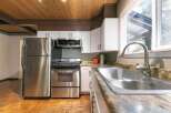 Step into this inviting kitchen, featuring stainless steel appliances and ample counter space.