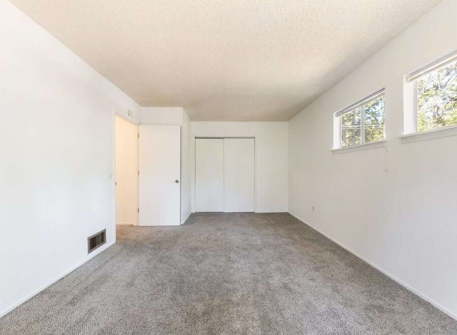 Step into this inviting space, featuring a neutral color palette and ample natural light.