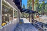 This charming property boasts a welcoming covered porch, perfect for enjoying the serene surroundings.