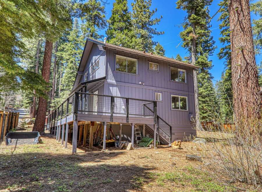 Nestled in a serene, wooded setting, this charming two-story home offers a perfect blend of comfort and nature.