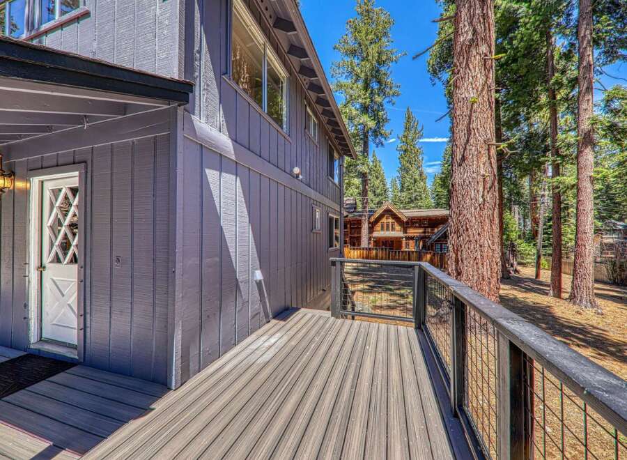 Enjoy the tranquility of this stunning property, featuring a spacious deck perfect for outdoor relaxation.