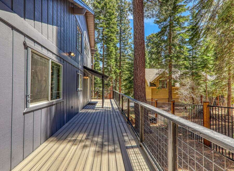 Enjoy the tranquility of this stunning property with a spacious deck, perfect for relaxing and taking in the surrounding natural beauty.