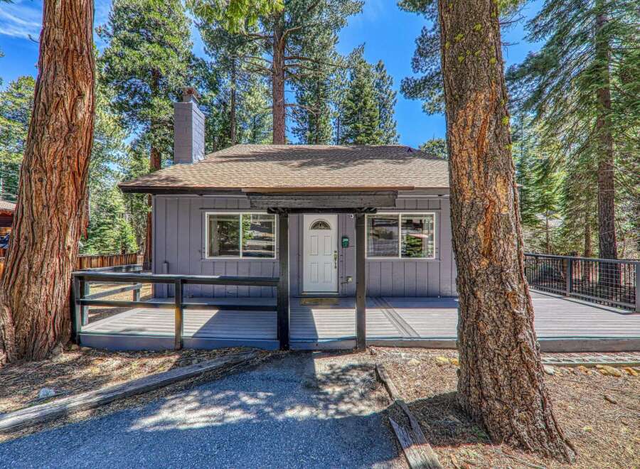 Nestled in a serene, wooded setting, this charming home offers a tranquil escape.
