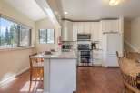This stunning kitchen boasts modern appliances and a bright, airy design, perfect for culinary enthusiasts.