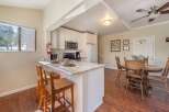 This charming kitchen features a breakfast bar with seating, perfect for casual dining or entertaining.