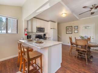 This charming kitchen features a breakfast bar with seating, perfect for casual dining or entertaining.