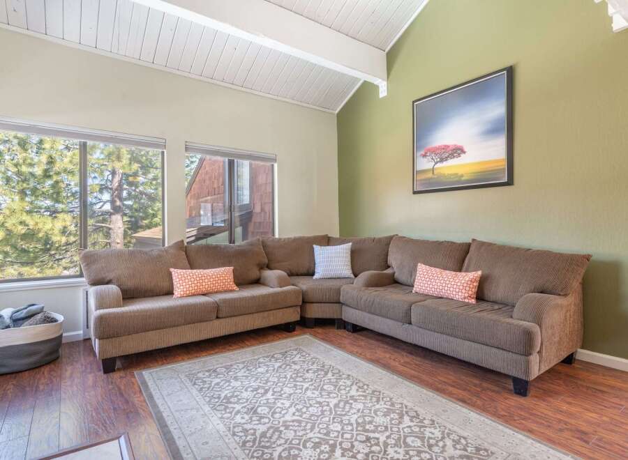 This inviting living room boasts a comfortable sectional sofa, perfect for relaxing and entertaining.