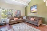 This inviting living room boasts a comfortable sectional sofa, perfect for relaxing and entertaining.