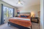 Step into this inviting bedroom, featuring a cozy bed adorned with plush bedding and decorative pillows.