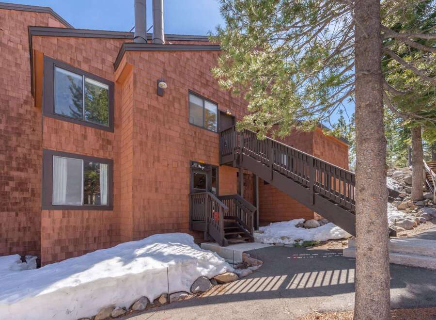 This charming property boasts a unique architectural design with its warm, inviting exterior.