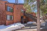 This charming property boasts a unique architectural design with its warm, inviting exterior.