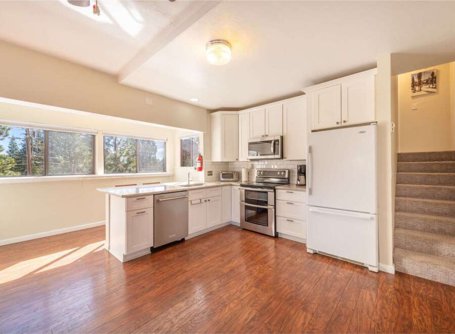 This stunning kitchen boasts a bright and airy atmosphere, perfect for culinary creations.